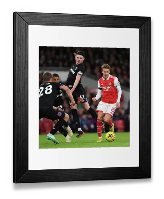 Framed Print : Clash of the Midfield Titans: Odegaard vs. Rice in Arsenal vs. West Ham Premier League Showdown