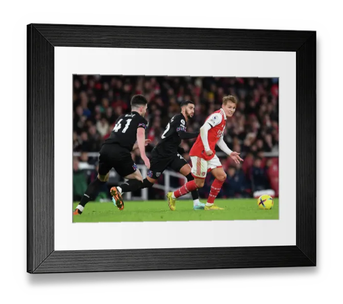 Framed Print : Arsenal's Odegaard Faces Pressure from West Ham's Benrahma in Premier League Clash