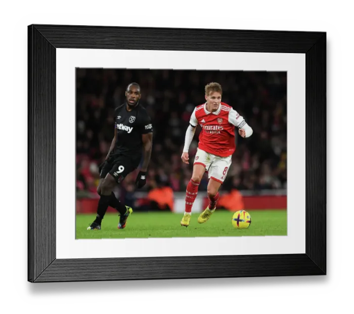 Framed Print : Martin Odegaard Shines: Arsenal's Holiday Triumph Over West Ham United