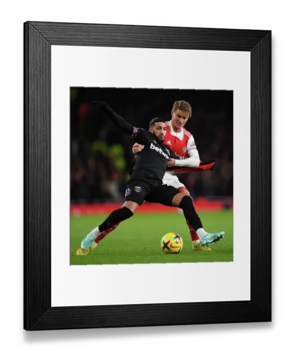 Framed Print : Arsenal's Odegaard Chases Down Benrahma: A Battle of Determination in Arsenal vs. West Ham Match Framed Print : Arsenal's Odegaard Chases Down Benrahma: A Battle of Determination in Arsenal vs. West Ham Match