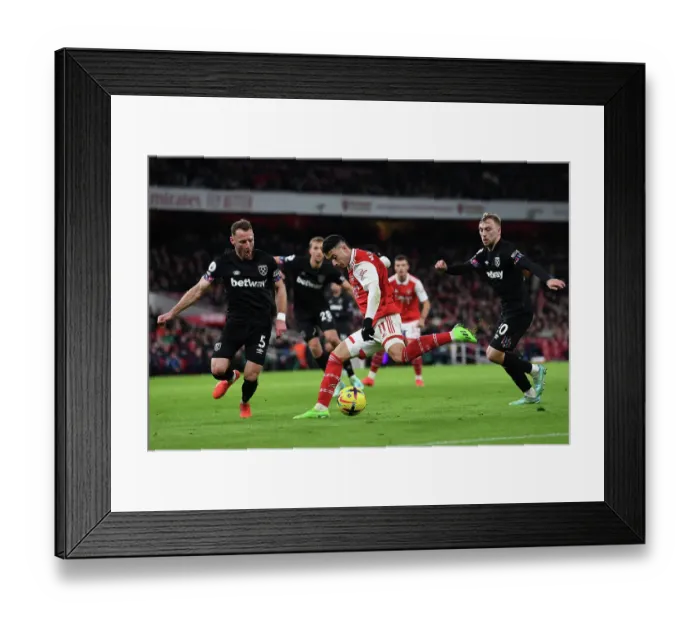 Framed Print : Arsenal's Martinelli Faces Off Against West Ham Duo in Intense Premier League Clash