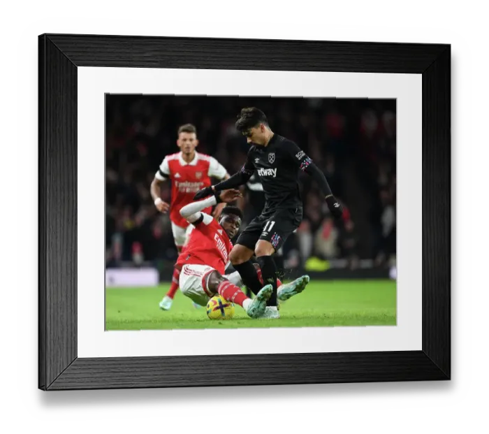 Framed Print : Arsenal vs. West Ham: Thomas Partey Faces Off Against Paqueta in Premier League Clash