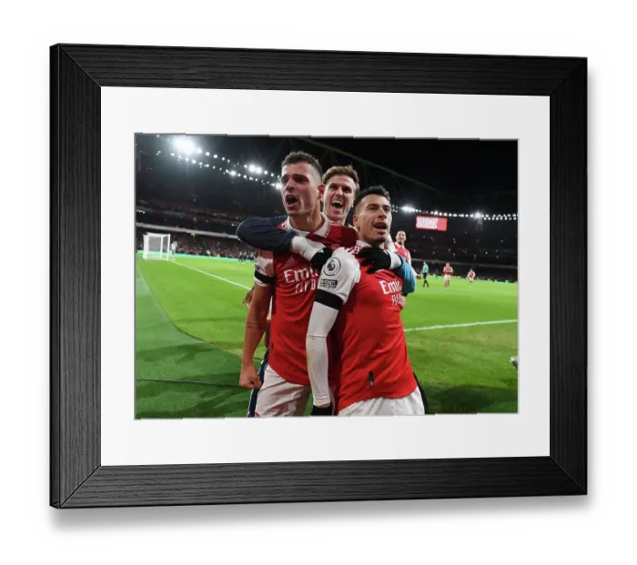 Framed Print : Martinelli's Brace: Arsenal Celebrate Holiday Victory Over West Ham
