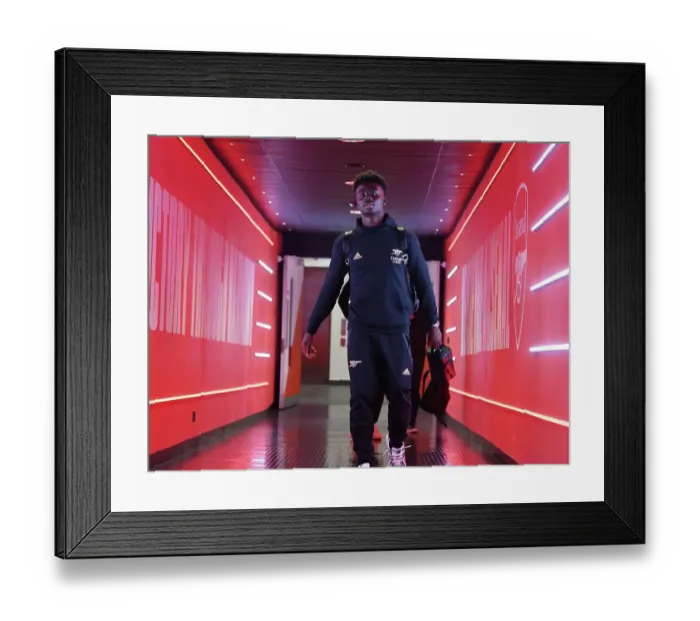 Framed Print : Arsenal's Battle-Ready Saka: Gunning for Victory Against West Ham United in the Premier League