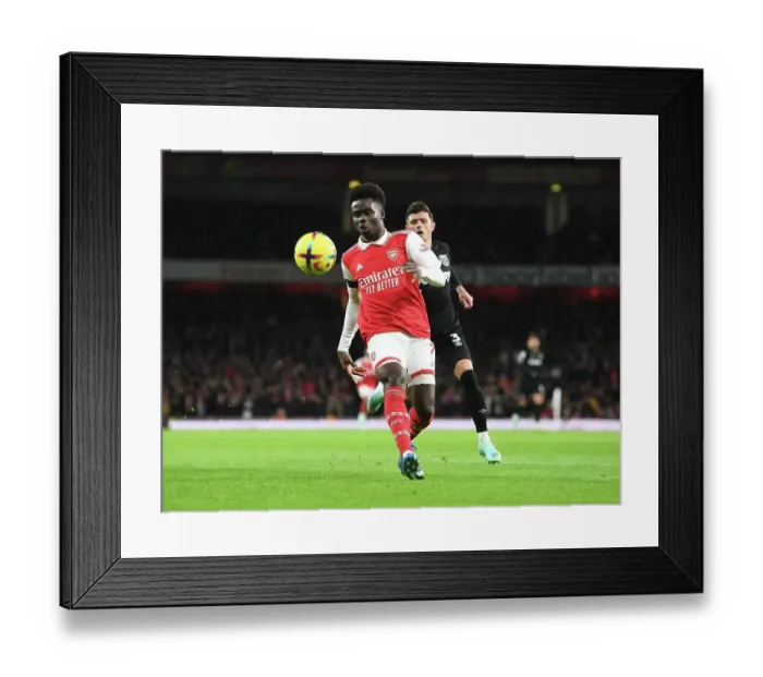 Framed Print : Arsenal's Bukayo Saka Shines in Holiday Showdown against West Ham United Framed Print : Arsenal's Bukayo Saka Shines in Holiday Showdown against West Ham United