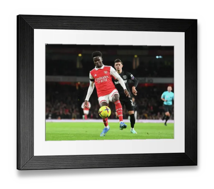 Framed Print : Bukayo Saka Shines: Arsenal's Christmas Victory Over West Ham United