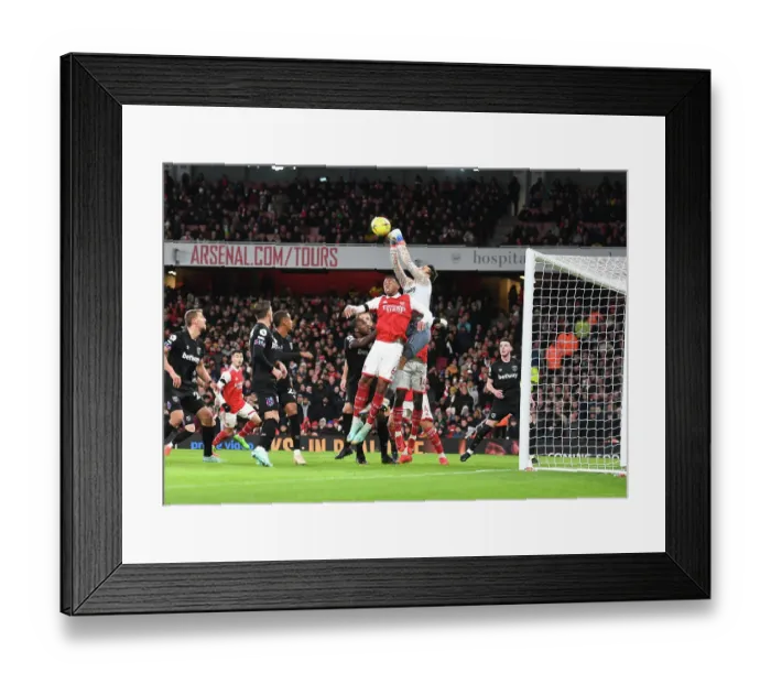 Framed Print : Arsenal's Gabriel Clashes with West Ham's Fabianski in Premier League Showdown