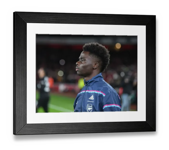 Framed Print : Bukayo Saka's Unwavering Determination: Arsenal's Young Star Gears Up for Arsenal vs. West Ham United Showdown