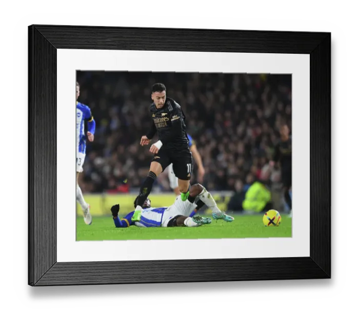 Framed Print : Gabriel Martinelli vs Tariq Lamptey: A Battle in the Premier League Clash between Brighton & Hove Albion and Arsenal FC Framed Print : Gabriel Martinelli vs Tariq Lamptey: A Battle in the Premier League Clash between Brighton & Hove Albion and Arsenal FC