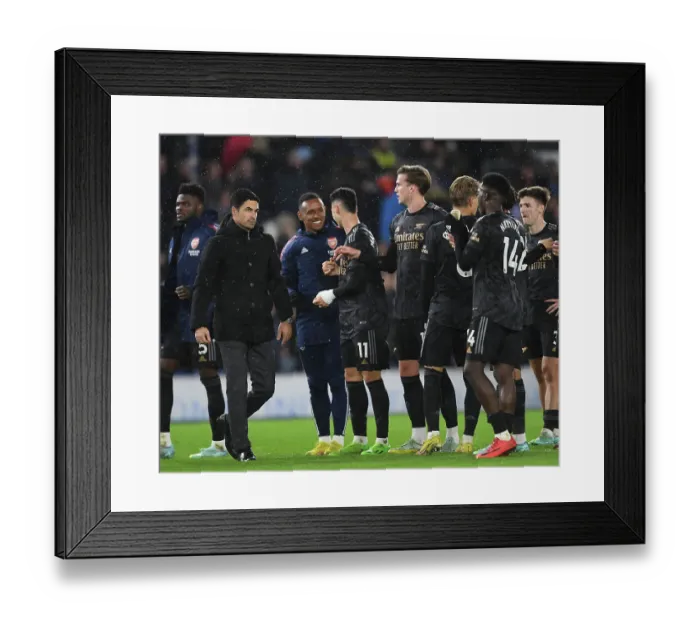 Framed Print : Arsenal's Victory Celebration: Arteta and Nketiah Rejoice after Beating Brighton in the Premier League 2022-23