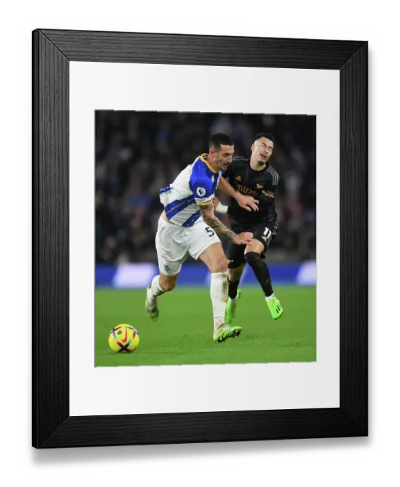 Framed Print : Brighton vs. Arsenal: Martinelli Faces Off Against Dunk in Premier League Clash