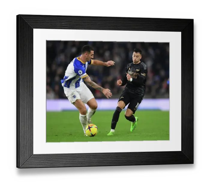 Framed Print : Martinelli vs. Dunk: A Fierce Battle in the Arsenal vs. Brighton Premier League Clash