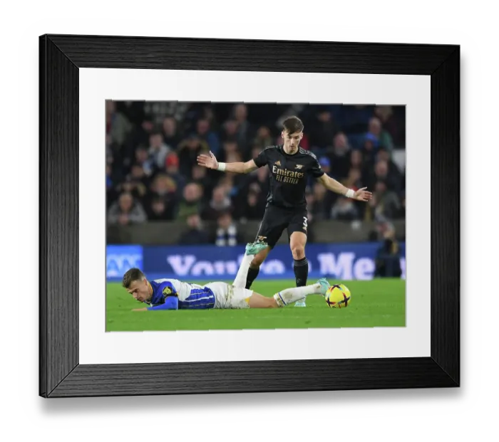 Framed Print : Arsenal's Kieran Tierney Faces Off Against Brighton's Solly March in Premier League Clash