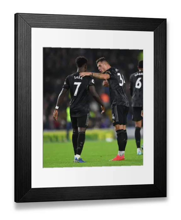 Framed Print : Xhaka and Saka in Action: Arsenal vs. Brighton & Hove Albion, Premier League 2022-23