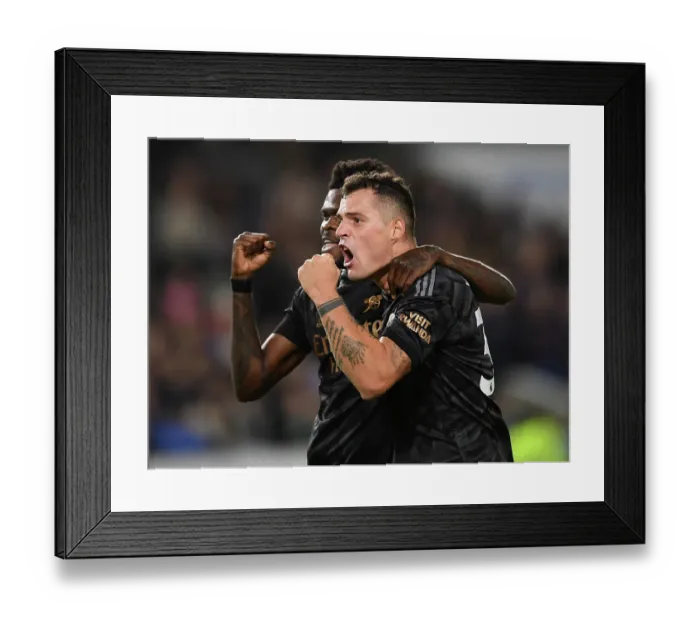 Framed Print : Fourth Goal Celebration: Xhaka and Partey Rejoice in Arsenal's Victory over Brighton (December 2022)