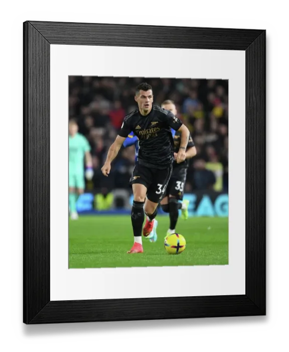 Framed Print : Granit Xhaka's Dominant Midfield Performance: Arsenal's Triumph over Brighton & Hove Albion (2022-23)