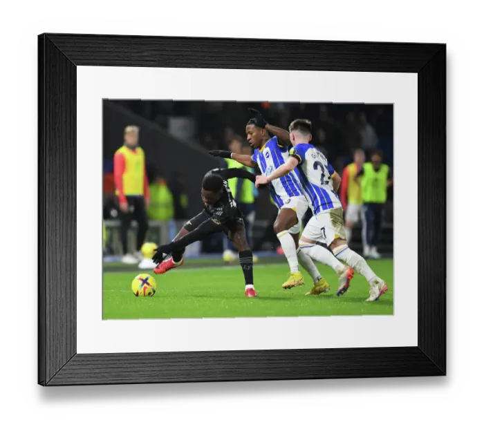 Framed Print : Arsenal's Nketiah Clashes with Brighton's Gilmour in Premier League Showdown