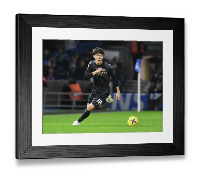 Framed Print : Arsenal's Takihiro Tomiyasu Faces Off Against Brighton in Premier League Clash