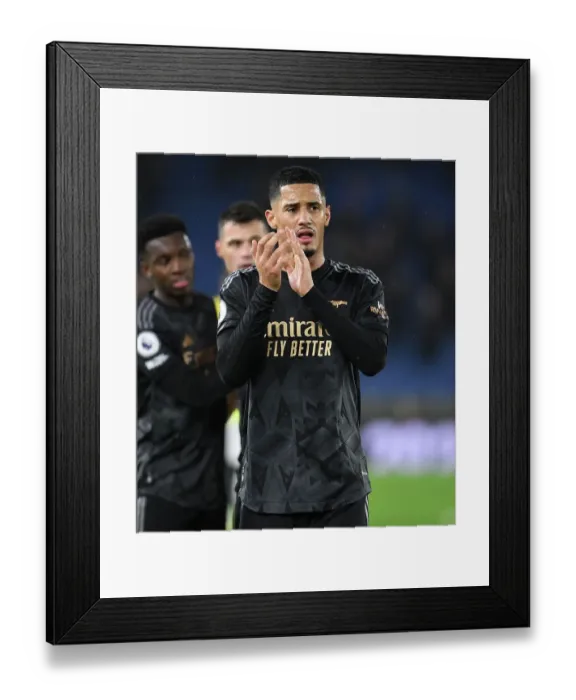 Framed Print : William Saliba's Debut Applause: Arsenal Secure Victory Over Brighton & Hove Albion (2022-23)
