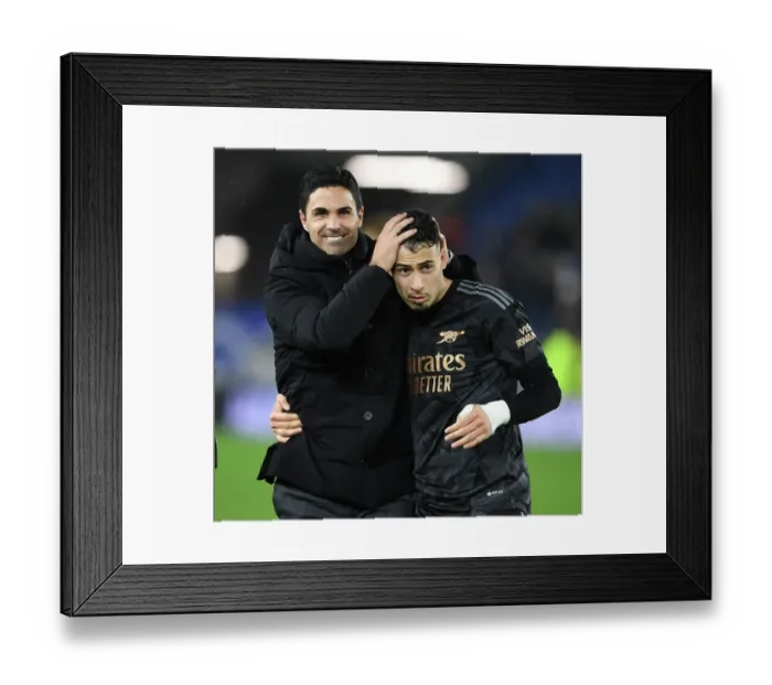 Framed Print : Arsenal's Victory: Arteta Celebrates with Martinelli vs. Brighton & Hove Albion (2022-23)