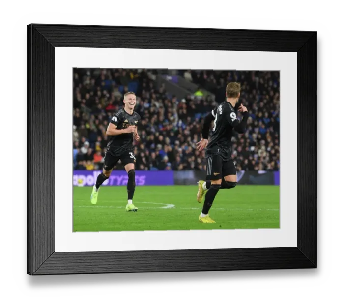 Framed Print : Arsenal's Unstoppable Duo: Odegaard and Zinchenko Celebrate Second Goal Against Brighton (December 2022)