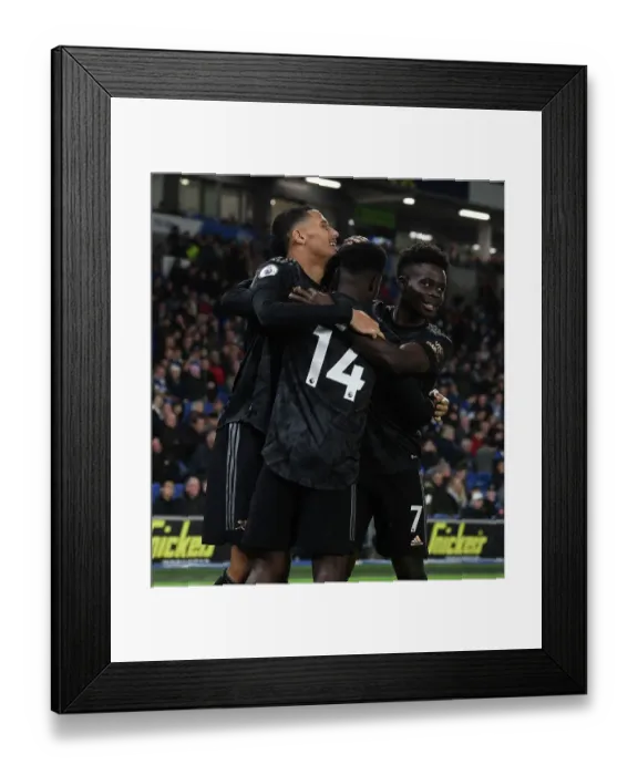 Framed Print : Nketiah Hat-trick: Saliba and Saka's Jubilant Celebrations as Arsenal Triumph Over Brighton Framed Print : Nketiah Hat-trick: Saliba and Saka's Jubilant Celebrations as Arsenal Triumph Over Brighton