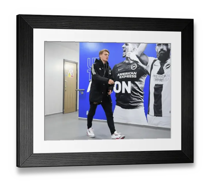 Framed Print : Martin Odegaard: Arsenal's Battle-Ready Midfielder Aims for Premier League Victory Against Brighton & Hove Albion