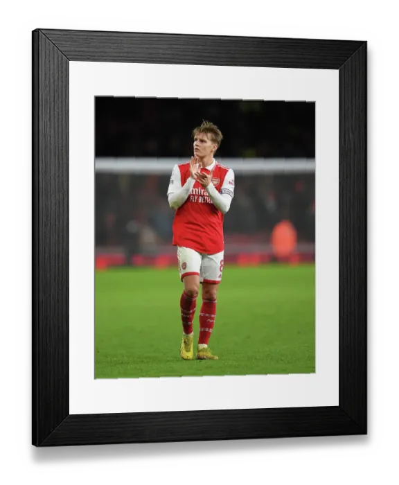 Framed Print : Arsenal's Martin Odegaard Celebrates with Fans after Victory over Newcastle United Framed Print : Arsenal's Martin Odegaard Celebrates with Fans after Victory over Newcastle United