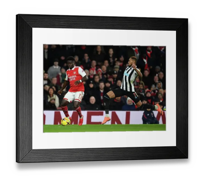Framed Print : Arsenal vs Newcastle: Bukayo Saka vs Joelinton - Premier League Clash at Emirates Stadium (January 2023)