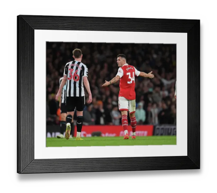 Framed Print : Arsenal's Xhaka and Longstaff in Deep Conversation During Arsenal v Newcastle Premier League Clash (2022-23)