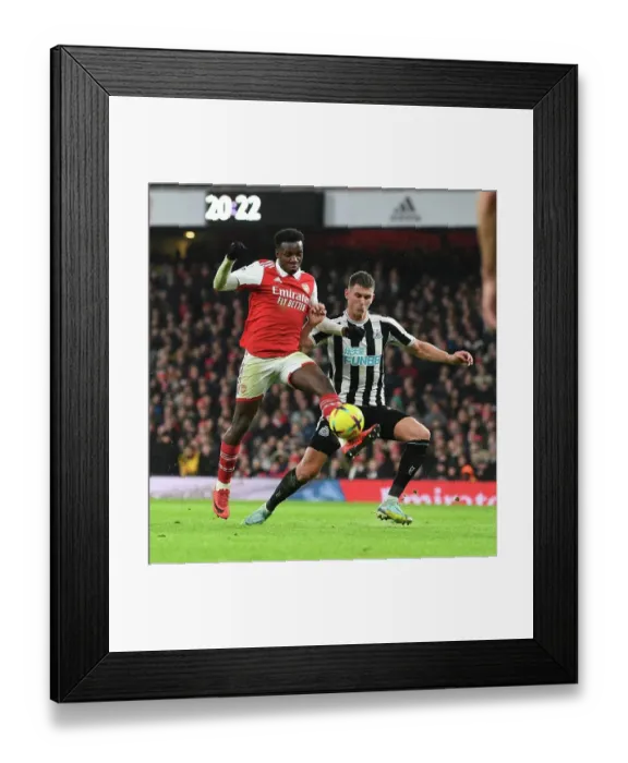 Framed Print : Arsenal vs Newcastle: Nketiah vs Botman Clash in Premier League Showdown