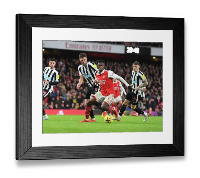 Framed Print : Arsenal's Eddie Nketiah Clashes with Newcastle's Fabian Schar in Premier League Showdown Framed Print : Arsenal's Eddie Nketiah Clashes with Newcastle's Fabian Schar in Premier League Showdown