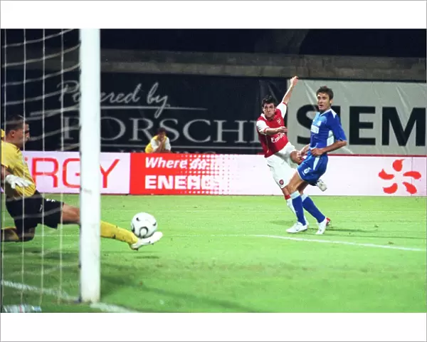 Cesc Fabregas shoots past Zagreb goalkeeper Ivan Turina to score the 1st Arsenal goal