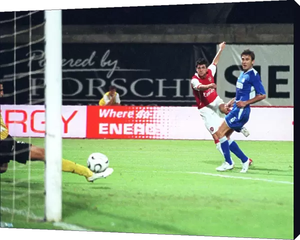 Cesc Fabregas shoots past Zagreb goalkeeper Ivan Turina to score the 1st Arsenal goal