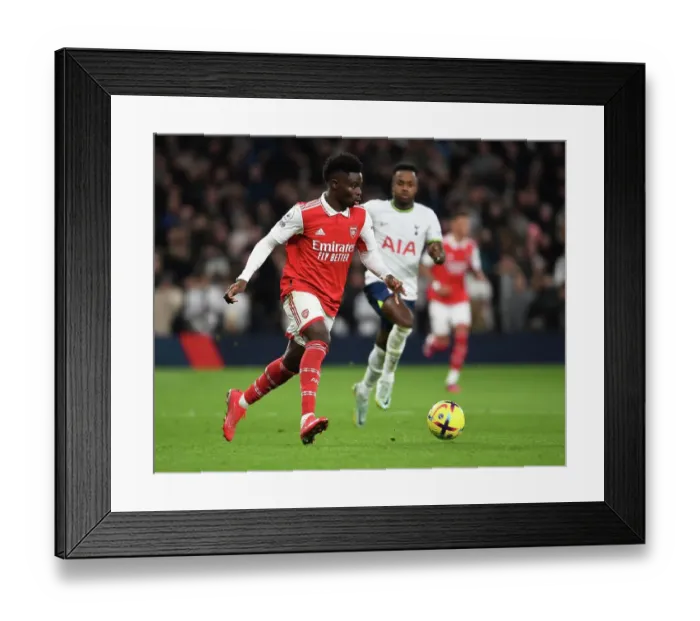 Framed Print : Arsenal's Bukayo Saka Faces Off Against Tottenham Hotspur in Premier League Showdown Framed Print : Arsenal's Bukayo Saka Faces Off Against Tottenham Hotspur in Premier League Showdown