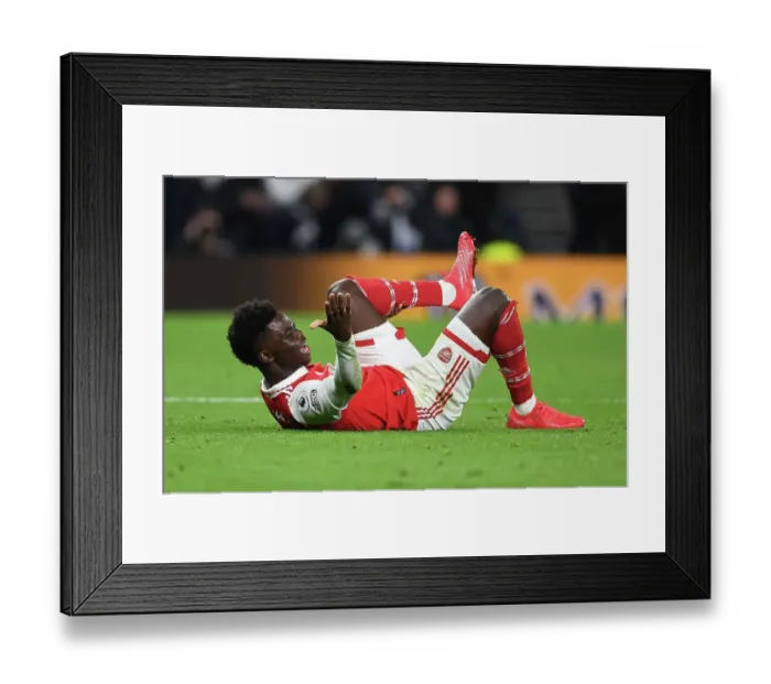 Framed Print : Bukayo Saka vs. Tottenham Hotspur: Intense Rivalry in the Premier League Clash at Tottenham Hotspur Stadium