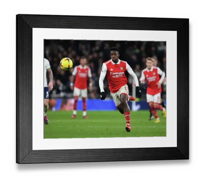 Framed Print : Arsenal's Eddie Nketiah Faces Off Against Tottenham Hotspur in Intense Premier League Clash (2022-23)