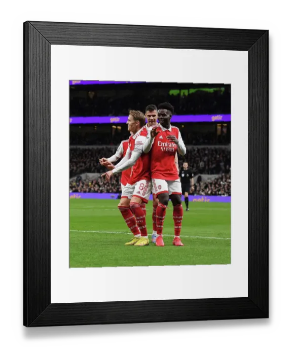 Framed Print : Saka, Odegaard, Xhaka: Arsenal's Triumphant Start to 2023 with Goal Celebration vs. Tottenham