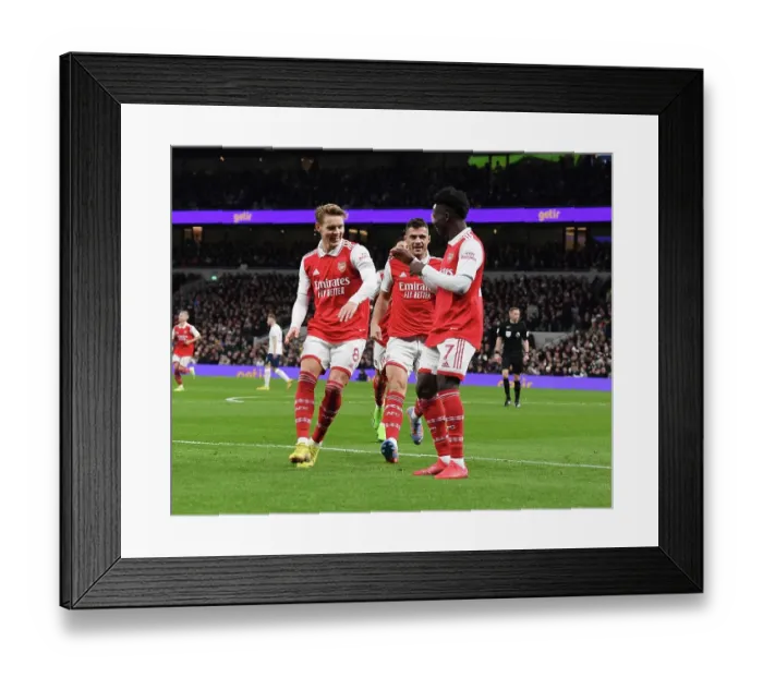 Framed Print : Arsenal's Triumphant Start to 2023: Saka, Odegaard, Xhaka Celebrate First Goals in Thrilling Tottenham Victory