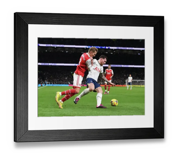 Framed Print : Odegaard vs. Hojbjerg: A Battle of Midfield Masters in the Premier League Showdown between Arsenal and Tottenham