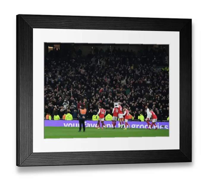 Framed Print : Arsenal's Glory: Celebrating a Hard-Fought Premier League Victory over Tottenham Hotspur in London