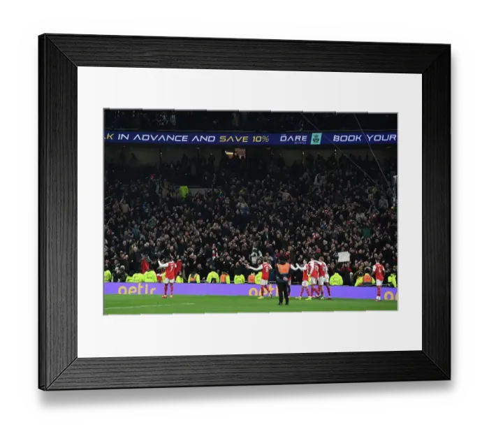 Framed Print : Arsenal's Glory: Celebrating a Premier League Victory over Tottenham Hotspur in London