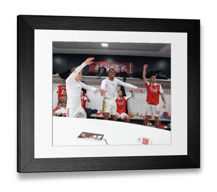 Framed Print : Arsenal Celebrates Hard-Fought Victory Over Tottenham in Premier League Clash