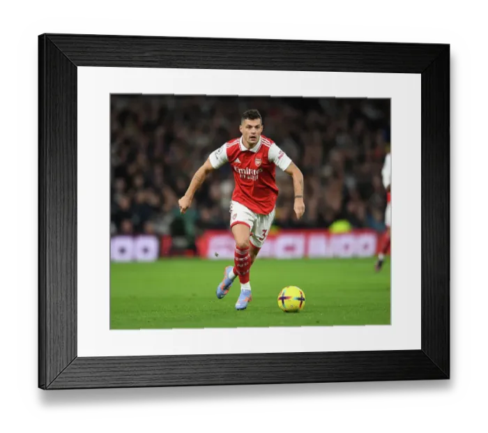 Framed Print : Intense Battle: Granit Xhaka's Performance for Arsenal Against Tottenham Hotspur in the Premier League 2022-23