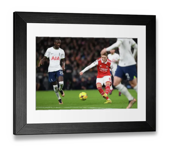 Framed Print : Martin Odegaard's Thrilling Split-Second Strike: Arsenal's Triumph in the London Derby vs. Tottenham Hotspur, Premier League 2022-23