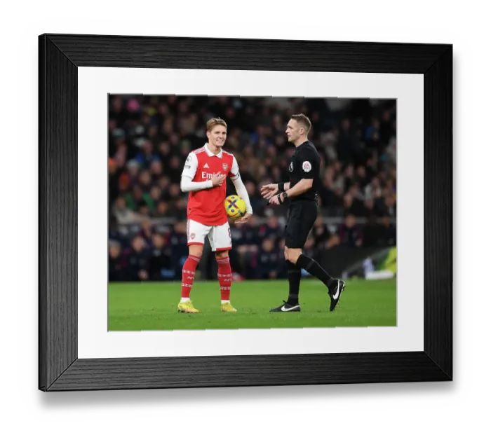 Framed Print : Martin Odegaard and Referee Craig Pawson in Action: Tottenham vs. Arsenal, Premier League 2022-23