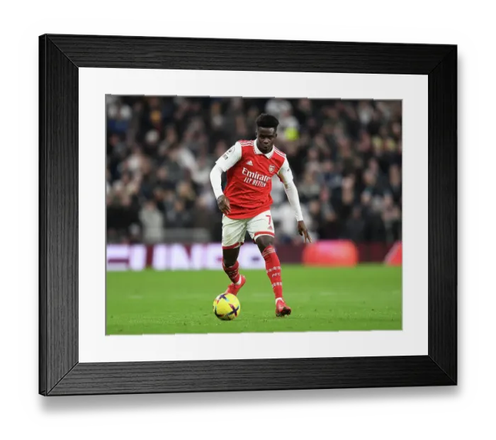 Framed Print : Bukayo Saka Faces Off Against Tottenham Hotspur in Intense Premier League Showdown