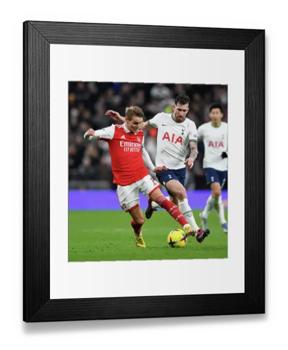 Framed Print : Clash in the Capital: Odegaard vs. Hojbjerg - A Premier League Showdown