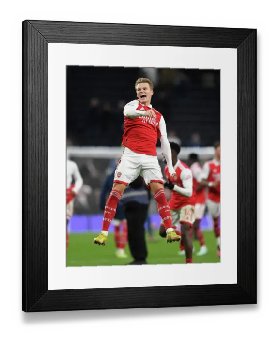 Framed Print : Martin Odegaard's Goal: Arsenal Celebrates Premier League Victory Over Tottenham Hotspur