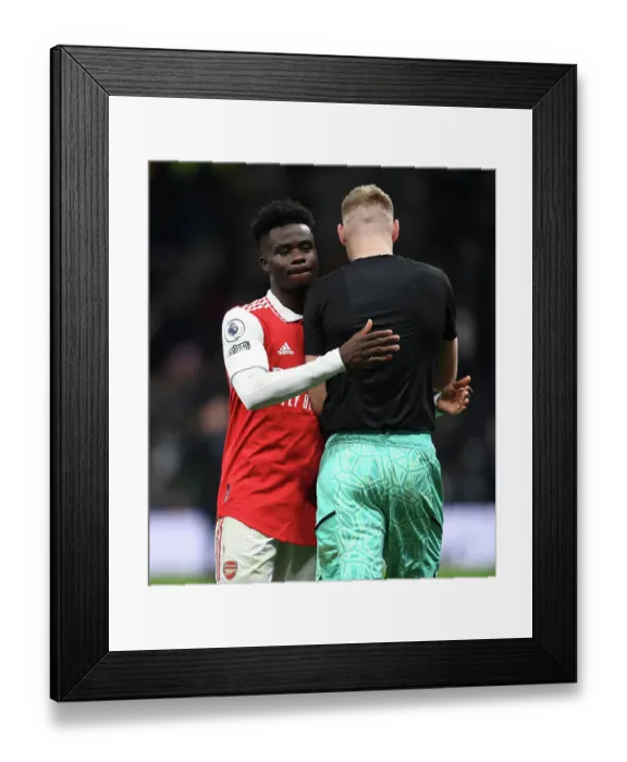 Framed Print : Arsenal's Bukayo Saka and Aaron Ramsdale Celebrate Victory over Tottenham Hotspur in 2022-23 Premier League Clash